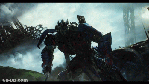 Transformer With Sword Standing In Field GIF