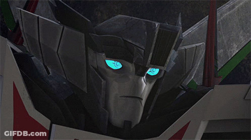 Transformers Head Closeup With Blue Eyes GIF