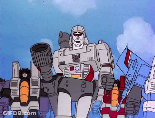 Transformers Standing Together One With Gun GIF