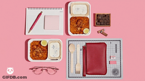 Tray Of Food Beside Notebook And Pen GIF