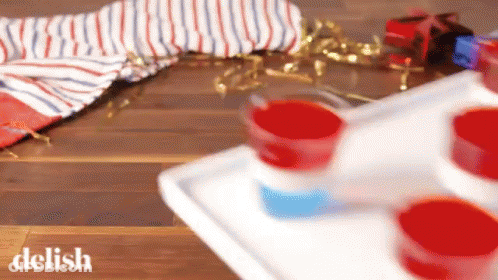 Tray Of Red White And Blue Shot Glasses GIF