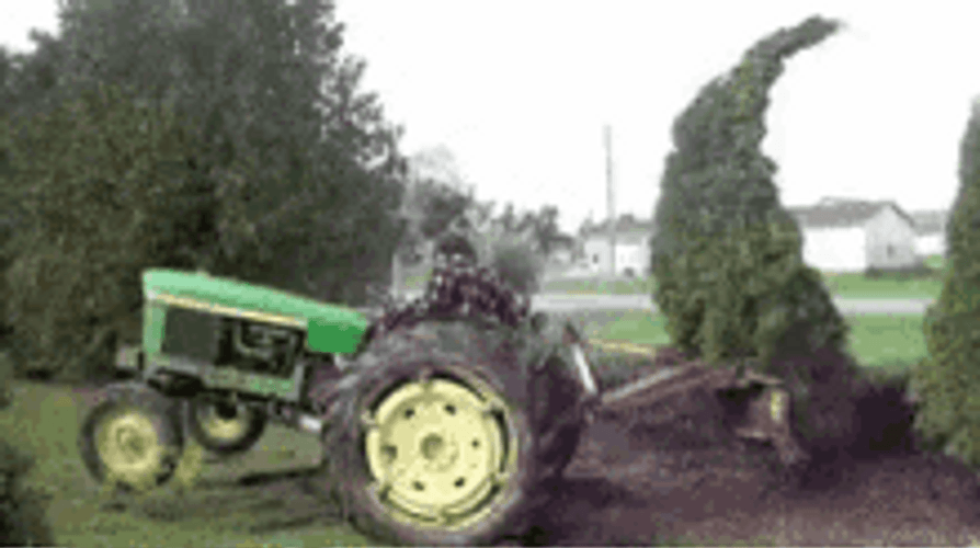 Tree Beating Up Farmer And Tractor GIF