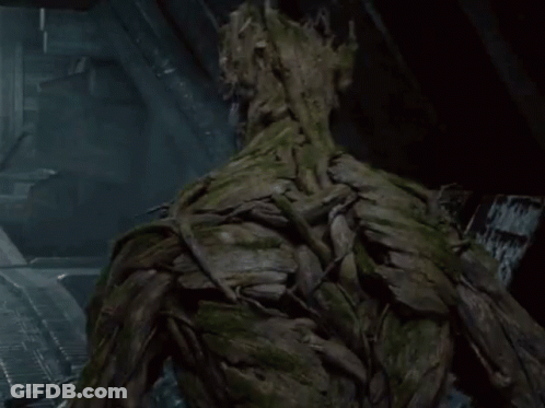 Tree Trunk Face Statue GIF