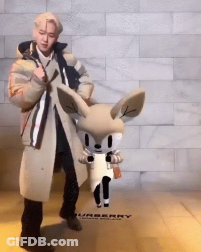 Trench Coat Man With Stuffed Animal Burberry Sign GIF