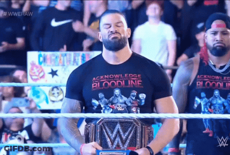Tribal Chief Roman Holding And Looking His Belt GIF