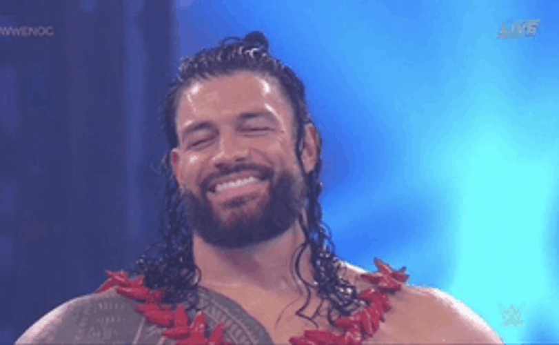Tribal Chief Roman Reigns Smiling While Closing Eyes GIF