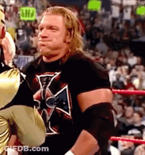 Triple H Controlling Laughter In Mockery GIF