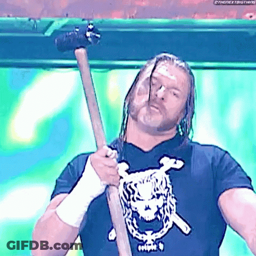 Triple H Wielding A Sledge Hammer GIF
