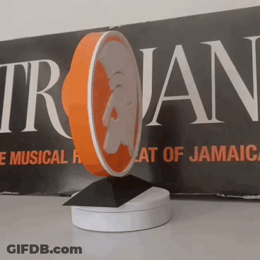 Trojan Sign In Front Of Trojan Logo GIF