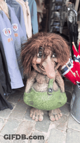 Troll Statue With Green Skirt GIF