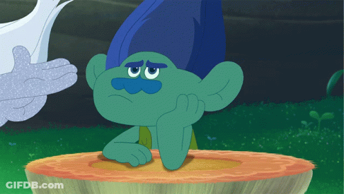 Troll With Blue Hair And Mustache Sitting On Stump GIF