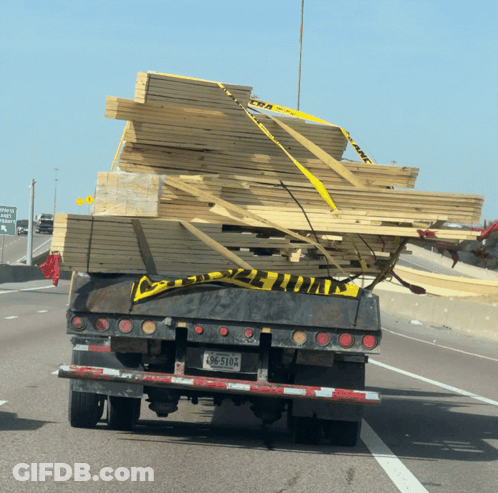 Truck Carrying Stack Of Wood With License Plate BC-510A GIF