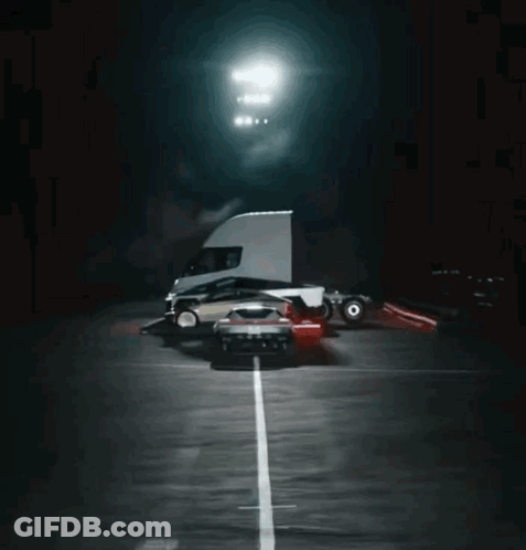 Truck Driving Down Road With Car On Back GIF