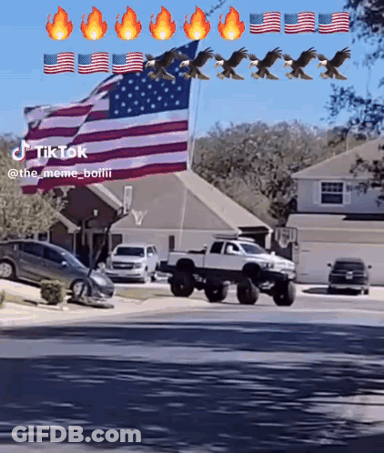 Truck Driving Past American Flag GIF