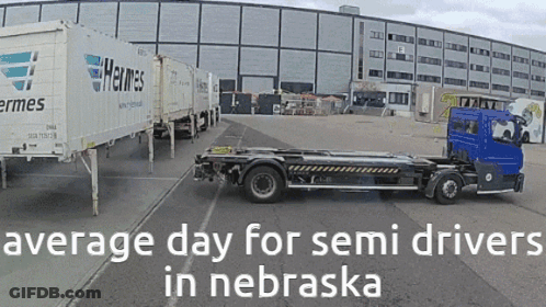 Truck Parked In Front Of Building Saying Average Day For Semi Drivers In Nebraska GIF