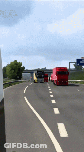 Trucks Driving Down Highway With La Riviera Sign GIF