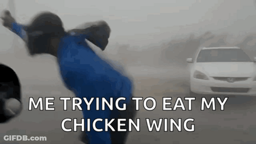 Trying To Eat Chicken Wing Hurricane Meme GIF