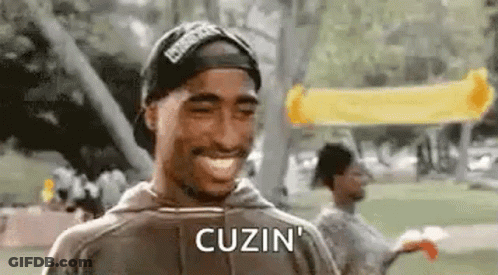 Tupac Shakur Smiling With Hat And Hoodie GIF