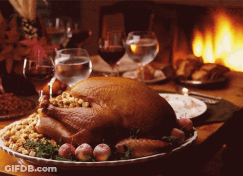Turkey Sitting On Plate With Wine Glasses GIF