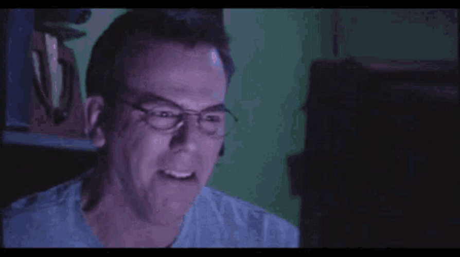 Turning Off Laptop Laughing Then Crying GIF
