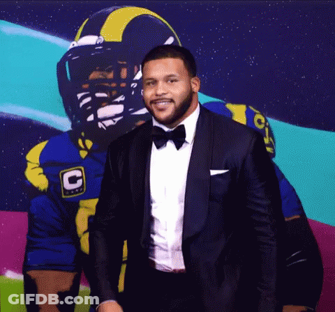 Tuxedo Man And Football Player With C Helmet GIF