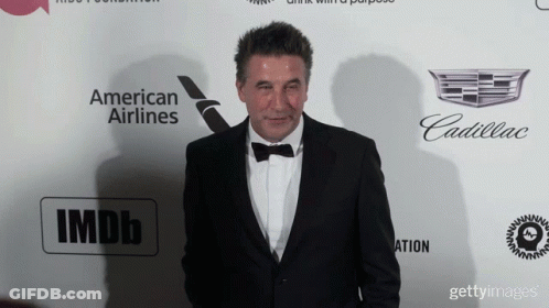 Tuxedo Man Facing Wall With American Airlines, Cadillac, IMDb GIF