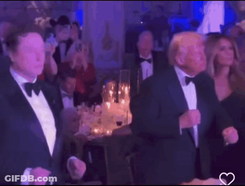 Tuxedo Man Next To Bow Tie Man In Crowd GIF