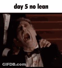 Tuxedo Man Screaming While Another Holds Shoulder GIF