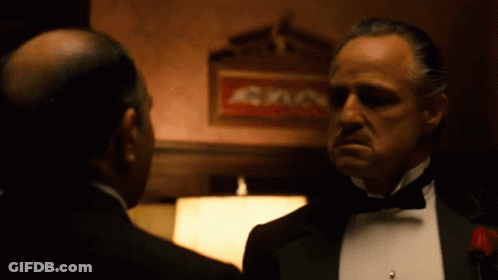 Tuxedo Man Talking To Another By Sign A GIF