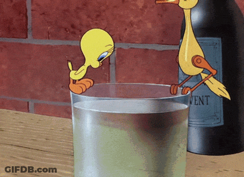 Tweety Drinking From Glass Next To Bottle Of Vent GIF