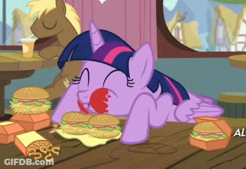 Twilight Sparkle From My Little Pony Is Laying On A Table Eating A Hamburger GIF