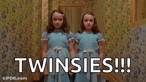 Twins From The Shining Holding Hands In Hallway GIF