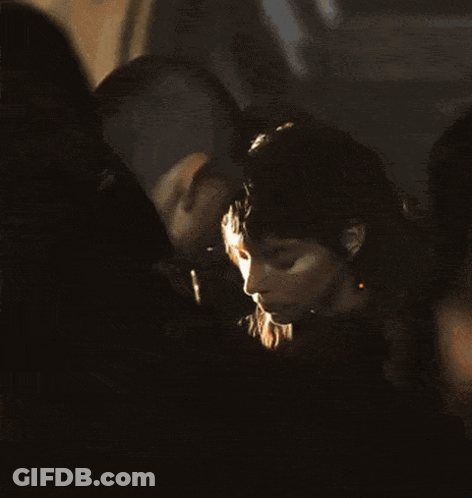 Two Aliens Standing In A Field GIF