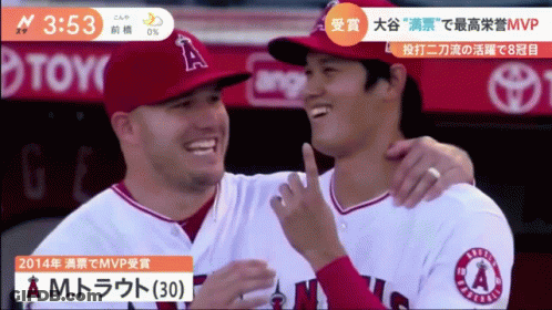 Two Angels Baseball Players Are Hugging And Smiling For A Photo GIF