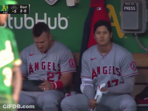 Two Angels Baseball Players Sit On A Bench GIF