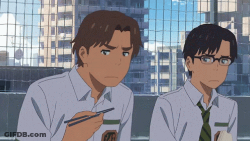 Two Anime Boys Are Sitting Next To Each Other And One Is Holding Chopsticks GIF