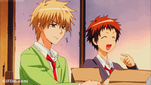Two Anime Characters Are Sitting Next To Each Other And One Of Them Is Pointing GIF