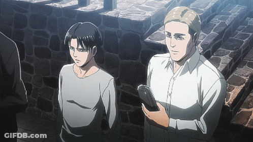 Two Anime Characters Are Standing Next To Each Other And One Is Holding A Book GIF