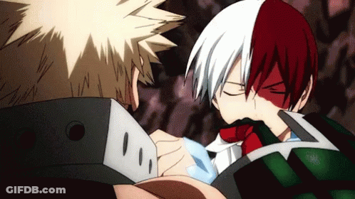 Two Anime Characters , Bakugo And Todoroki , Are Standing Next To Each Other And Looking At Each Other . GIF