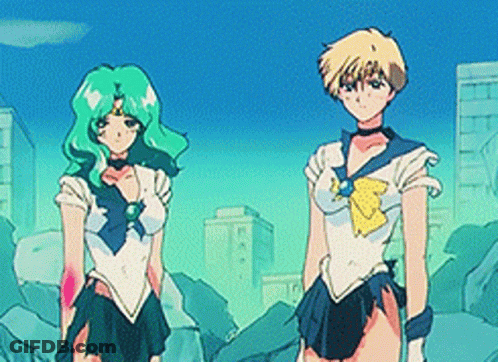 Two Anime Characters Standing In A City GIF