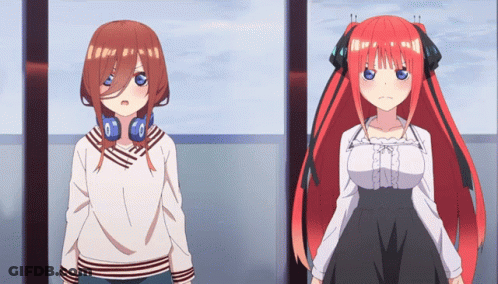 Two Anime Girls Are Standing Next To Each Other And One Has Headphones On GIF