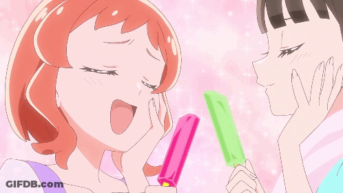 Two Anime Girls Are Standing Next To Each Other And One Is Holding An Ice Cream Bar GIF