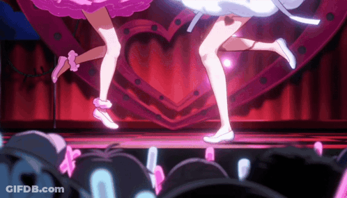 Two Anime Girls Dancing On Stage With Heart Sign GIF