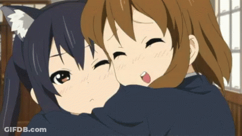 Two Anime Girls Hugging Each Other And One Has A Cat Ear On Her Head GIF