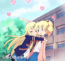 Two Anime Girls Hugging Each Other In Front Of A Building With Hearts In The Sky GIF