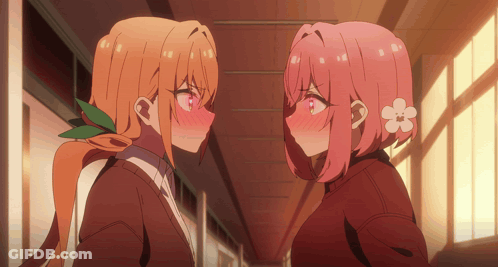 Two Anime Girls Looking At Each Other One With Flower In Hair GIF