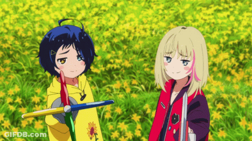 Two Anime Girls Standing In A Field Of Flowers GIF