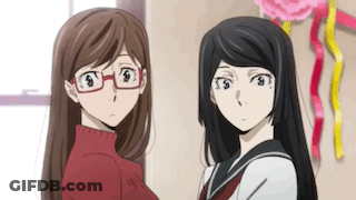 Two Anime Girls Standing In Room Looking At Each Other GIF