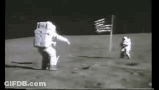 Two Astronauts Are Walking On The Moon . GIF