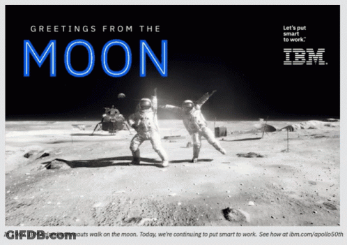 Two Astronauts On The Moon With The Words Greetings From The Moon Above Them GIF